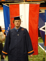 Commencement photo with Austrian flag in background